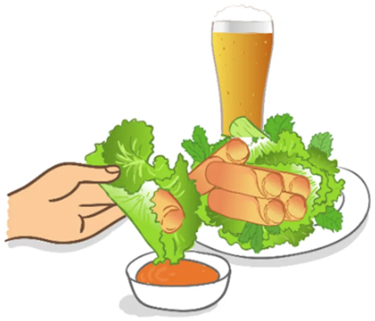 A hand wrapping an eggroll in a lettuce leaf and dipping it in sauce, beside a plate of eggrolls served on lettuce and a glass of beer.